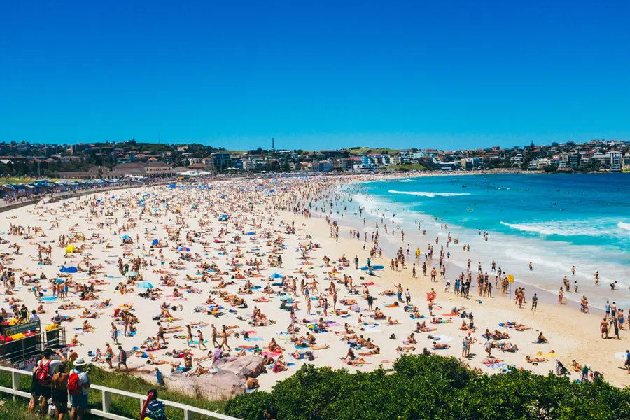 Picture of a fully crowded Bondi Beach.